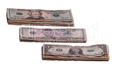 dollar notes in three stacks