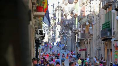 Busy street in old town of Barcelona, Catalonia, Spain