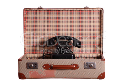 old suitcase with aged phone