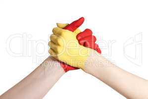 yellow and red hand in competition