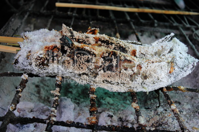 grilled snakehead fish covered by salt