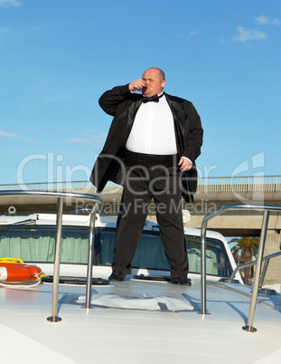 fat man in tuxedo with glass wine