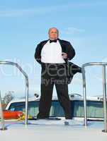 fat man in tuxedo with glass wine