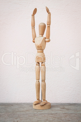 raising hands up and standing wooden poser