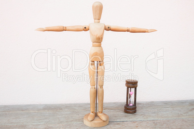 wooden mannequin extend the arms of count down