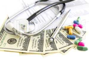 Money, stethoscope and pills, medical insurance