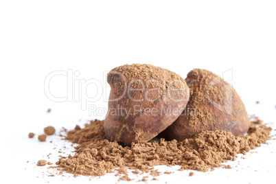 Chocolate truffles on cocoa powder