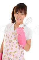 Asian girl holding egg beater