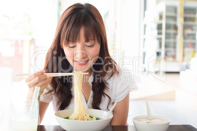 Eating noodles
