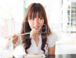 Asian girl eating dim sum