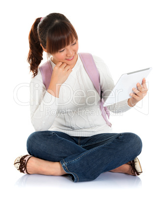 Asian female student using tablet pc