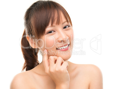 Skin care woman putting face cream