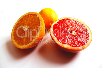 orange grapefruit and lemon divided in half