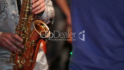 Saxophonist at a party