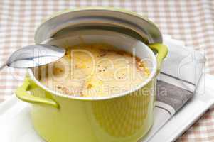 onion soup with melted cheese and bread on top