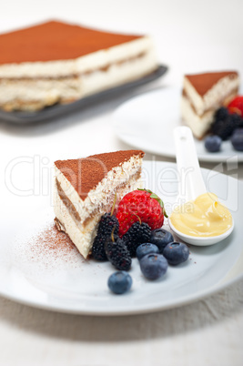 tiramisu dessert with berries and cream