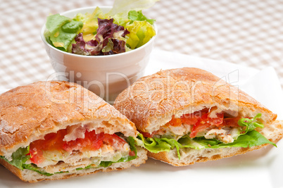 ciabatta panini sandwich with chicken and tomato