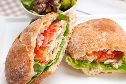 ciabatta panini sandwich with chicken and tomato