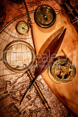 Vintage magnifying glass lies on an ancient world map