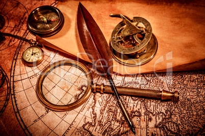 Vintage magnifying glass lies on an ancient world map