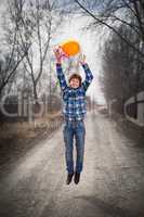 The cheerful boy with a balloon