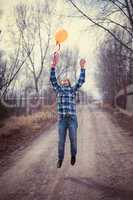The cheerful boy with a balloon