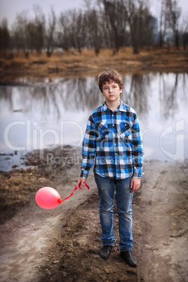 The sad boy with a balloon