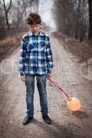 The sad boy with a balloon