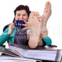 Office woman puts feet up relaxing
