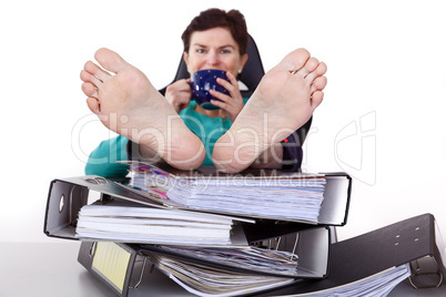 Office woman puts feet up relaxing