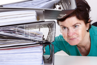 Woman looking at folders on the desk