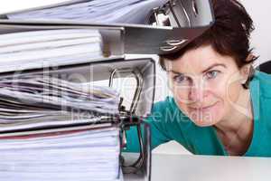 Woman looking at folders on the desk
