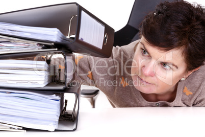 Woman looking at folders on the desk