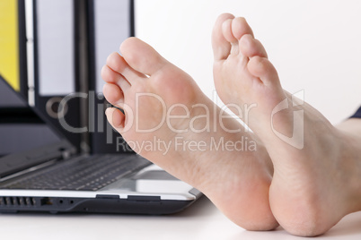 Bare feet on the desk