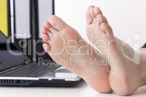 Bare feet on the desk