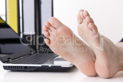 Bare feet on the desk
