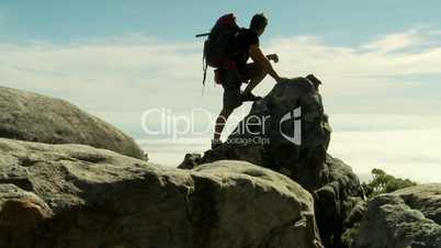 Climber with backpack on top of Table Mountain