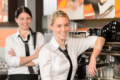 Two waitresses posing in coffee house