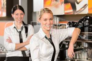 Two waitresses posing in coffee house
