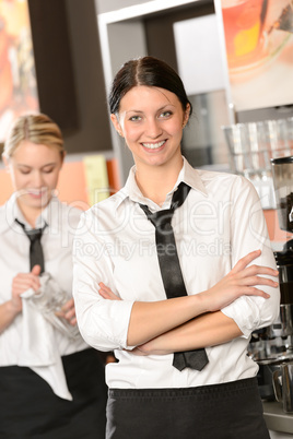 Confident waitress posing in cafe