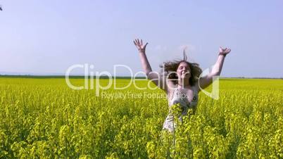 Girl and canola field