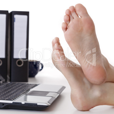 Bare feet on the desk