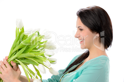 Elated young woman with bouquet of flowers