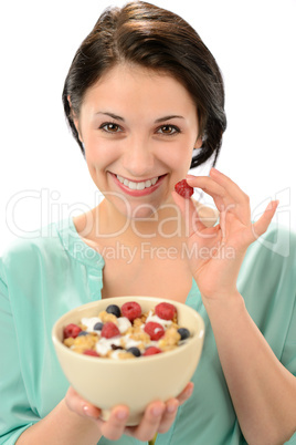 Friendly girl posing with cereal bowl