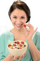 Friendly girl posing with cereal bowl