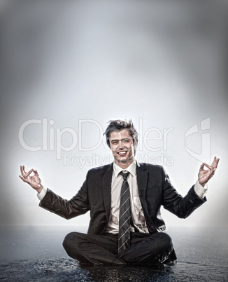 Businessman meditating and smiling