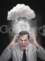 Businessman stressing out under a cloud