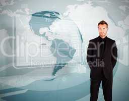 Businessman standing against world map display