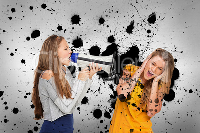 Girl shouting at friend through megaphone