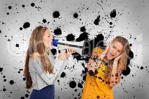 Girl shouting at friend through megaphone